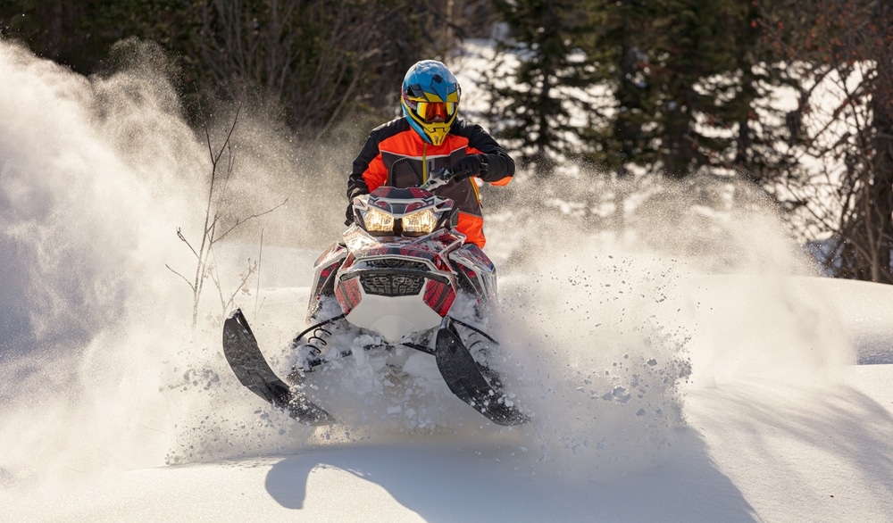 Snowmobiling on mountain trails is one of the best things to do during winter in Missoula