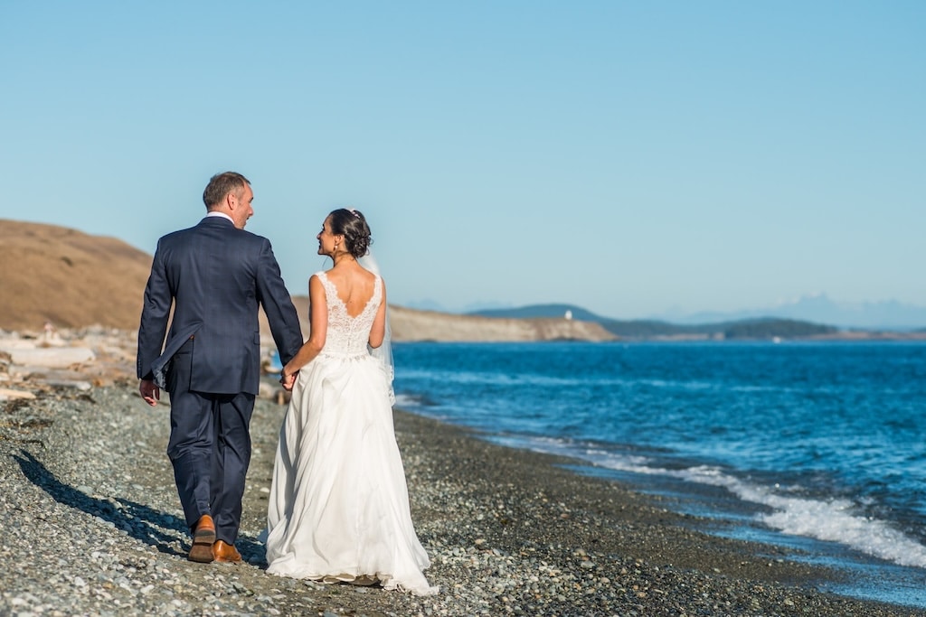 Couple getting married on the beach with one of the best San Juan Island wedding venues