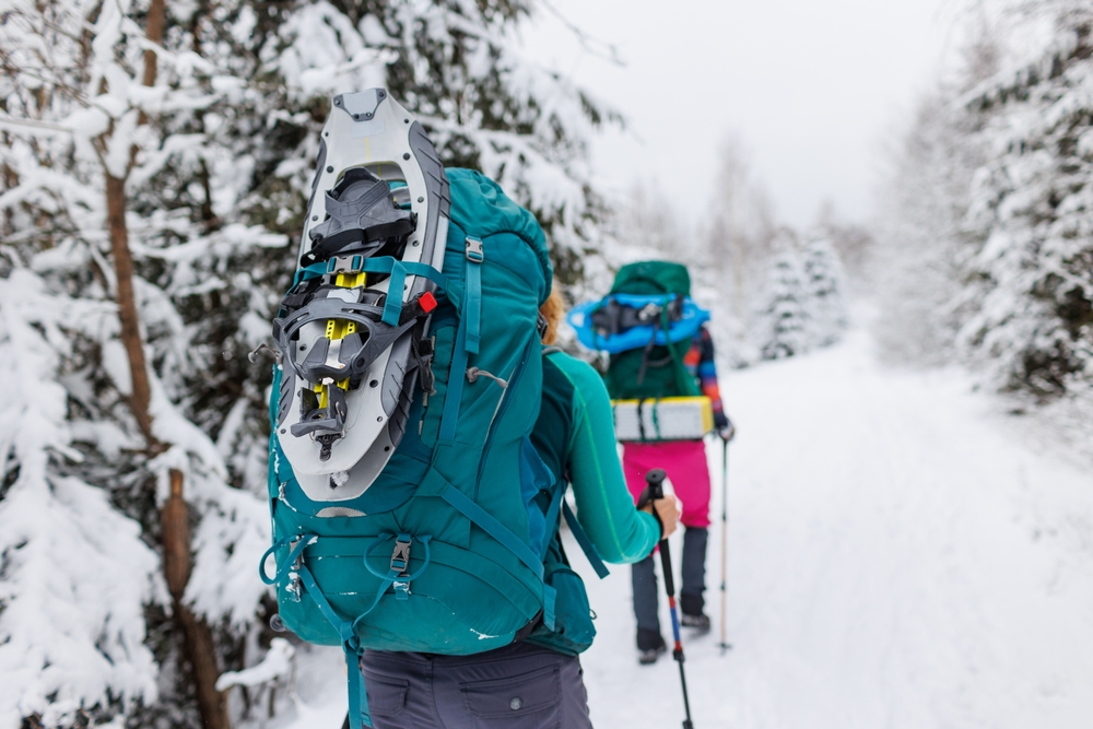 A couple snowshoeing at Savage River State Park this winter in Deep Creek Lake Maryland