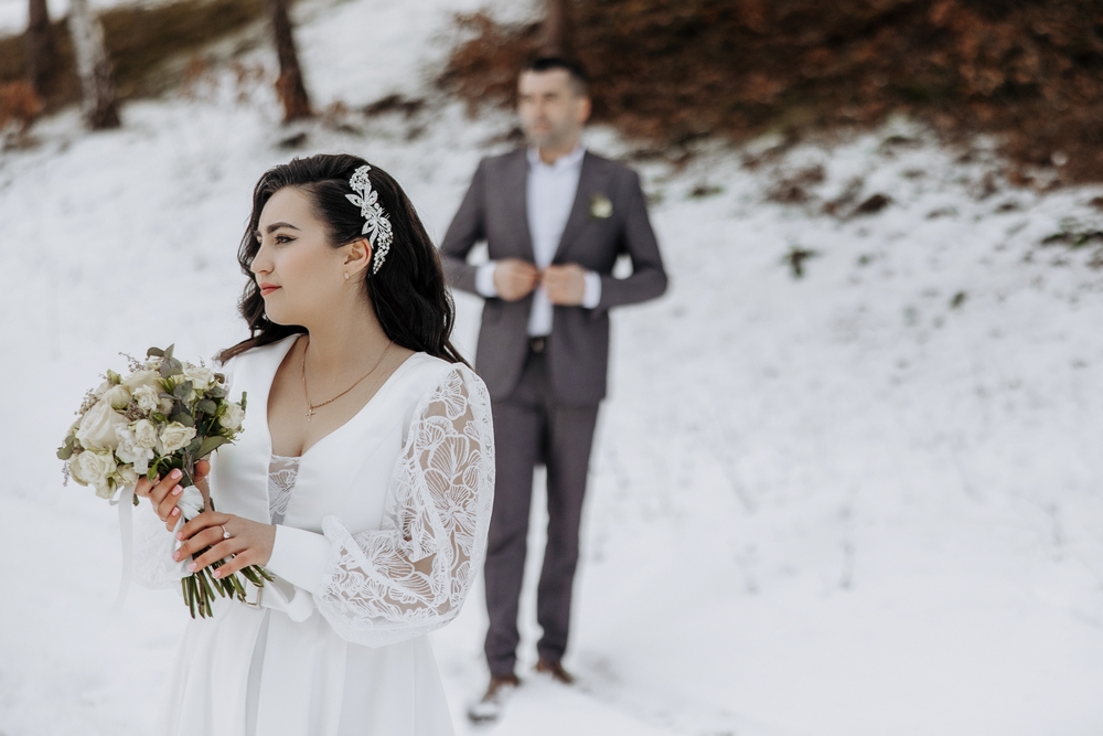 A happy couple eloping in Michigan in winter with the best elopement packages in Michigan