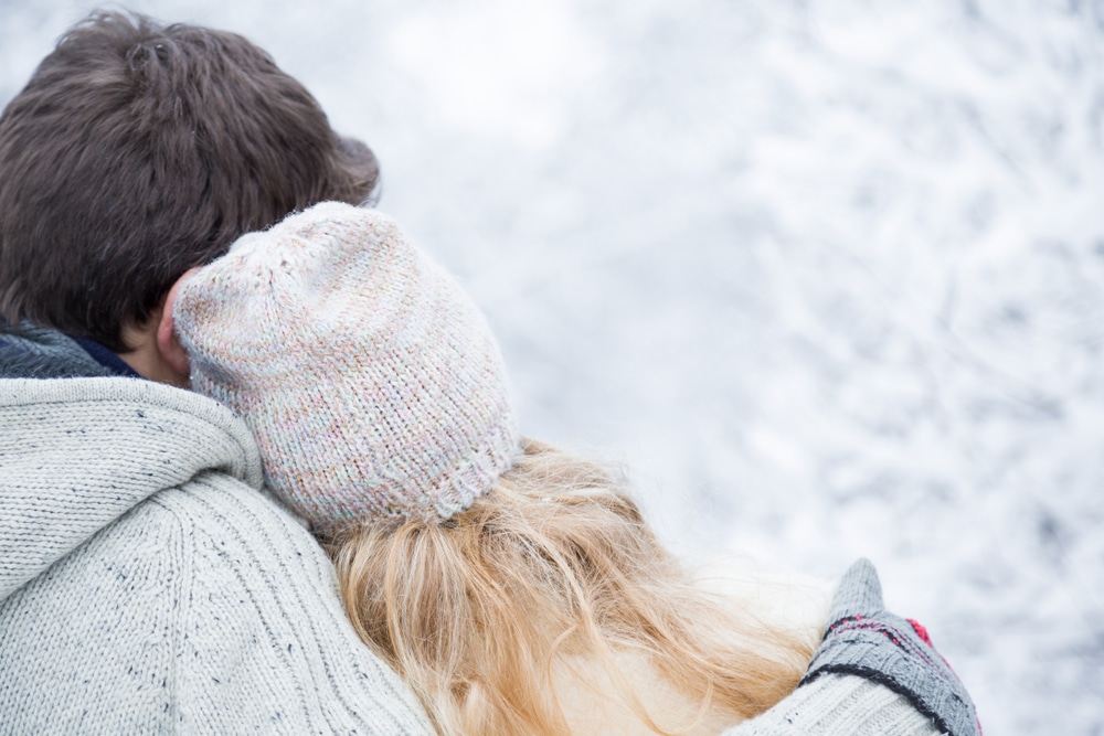 Weekend trips from Minneapolis for couples. A happy couple enjoying the snow