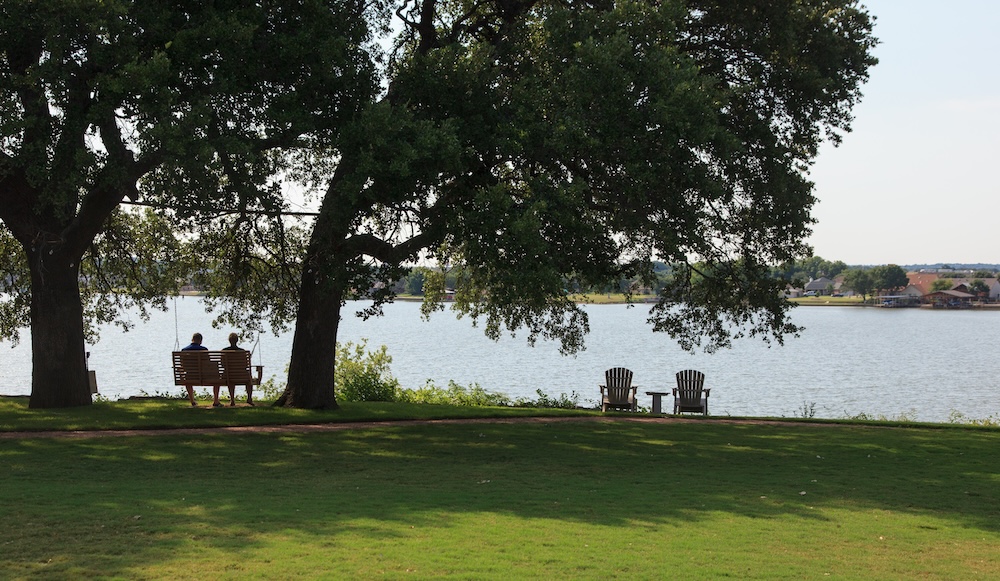 Couple enjoying the lake view at Inn on Lake Granbury, one of the most romantic places in Texas