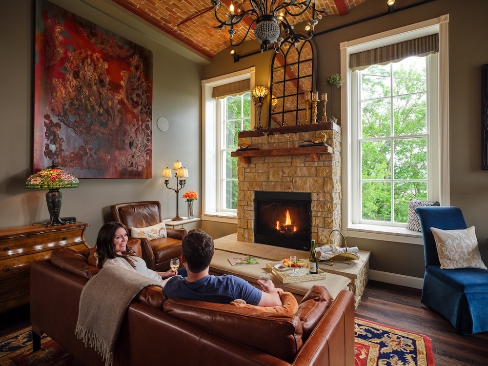 couple enjoying time in front of the fire at our Inn, one of the most romantic things to do in Galena, IL
