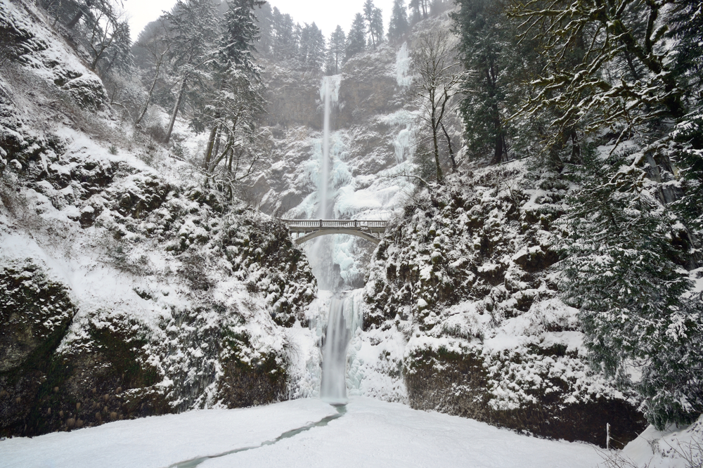 Winter at Multnomah Falls, one of the best things to do in the Columbia River Gorge during winter getaways at our luxury cabins