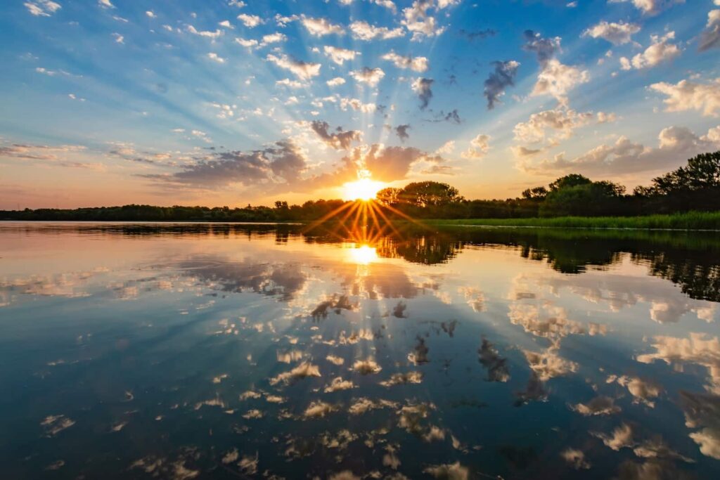 Beautiful sunset over water, enjoyed during romantic getaways in Nebraska near Omaha