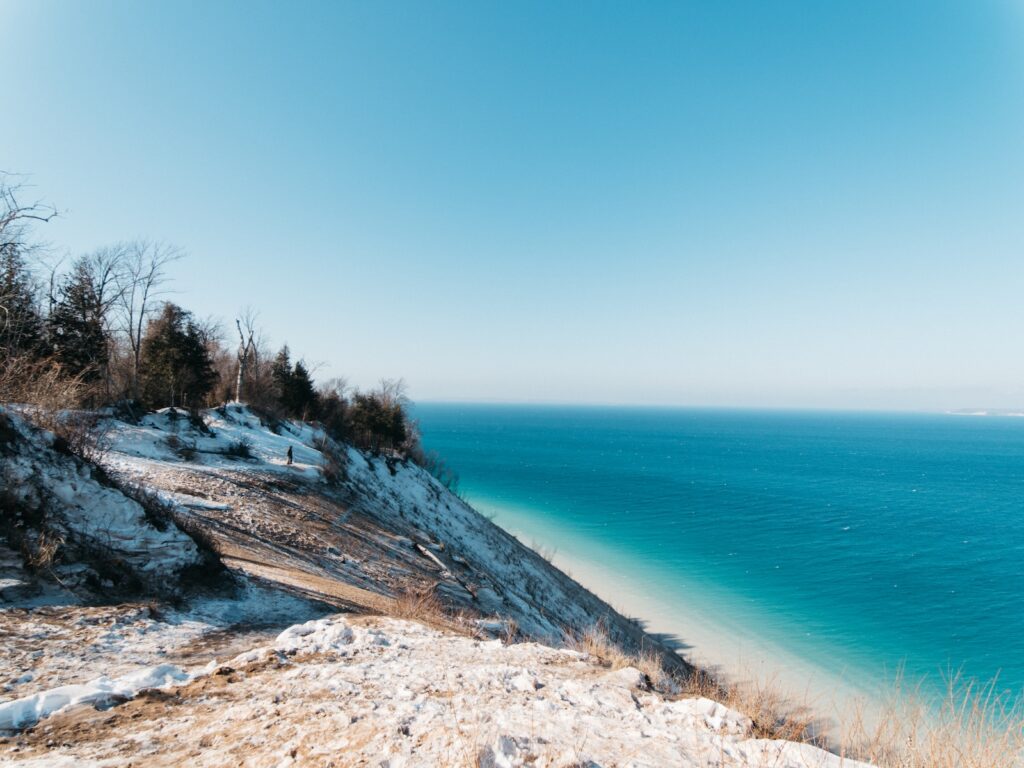 Snowy shores at Sleeping Bear Dunes, one of the best things to do in Traverse City in the winter