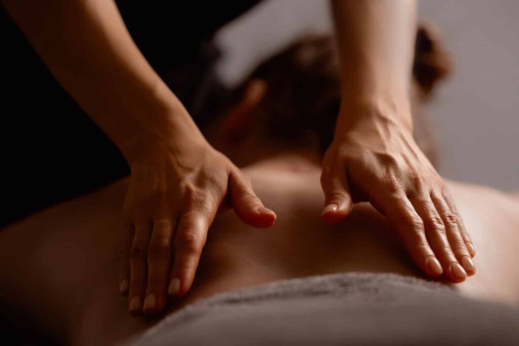 woman getting a massage during weekend spa getaways near Chicago