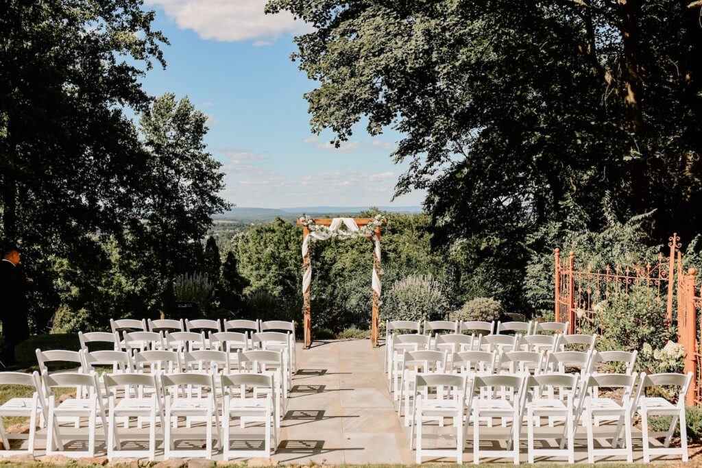A stunning view of a wedding aisle up high on a mountain in PA at one of the most romantic wedding venues in Reading