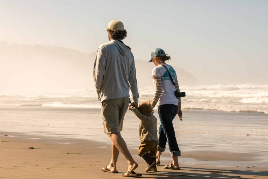 Plan your Oregon Coast Vacations to Bandon, family walking on Bandon Beach