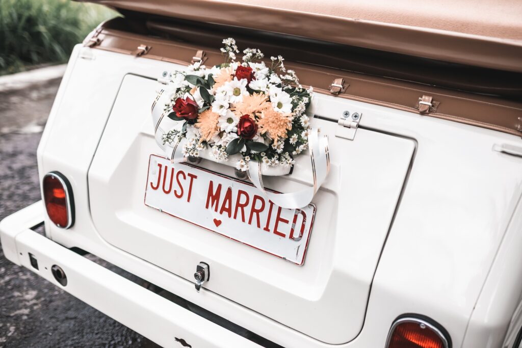 Explore Vermont honeymoon packages designed for couples who want a romantic getaway filled with adventure and quiet moments. Photo of a car decorated for newlyweds