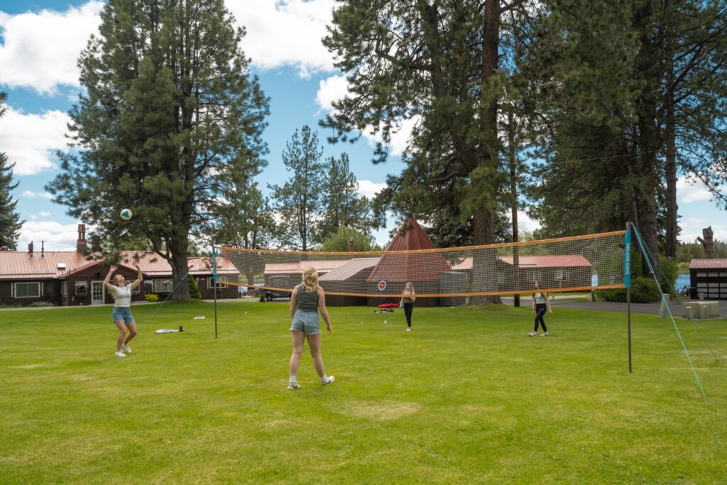 Best Vacation Spots in Oregon for Family Getaways, group of kids playing volleyball at this resort