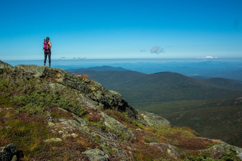 Woman hiking at the summit of Mount Washington New Hampshire