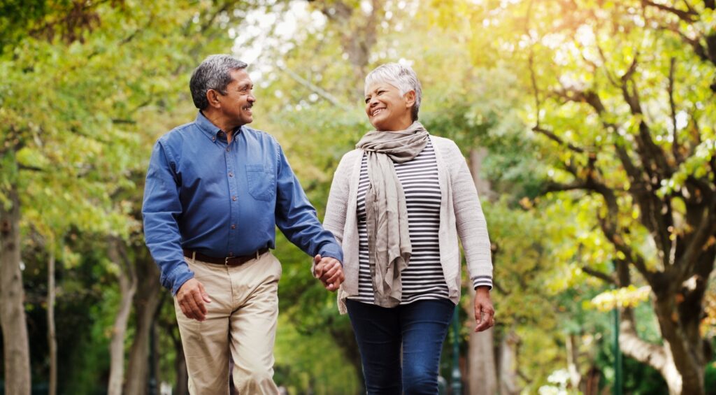 Happy middle aged couple holding hands at the Olbrich Botanical Gardens