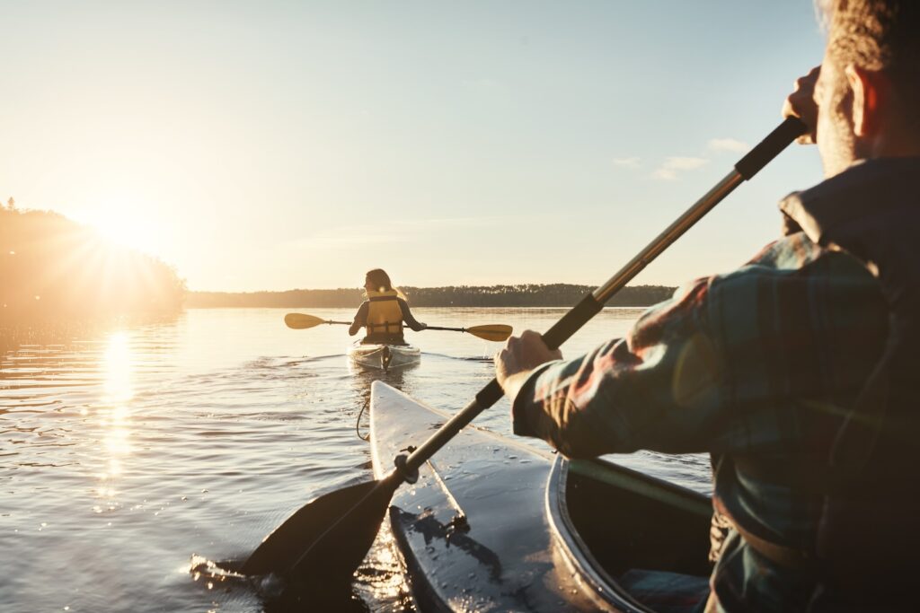 Friends kayaking on the best Madison Lakes this summer in Wisconsin