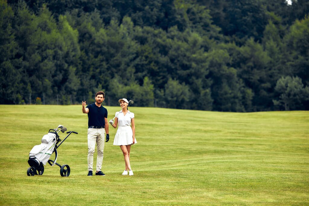 A couple enjoying a round of golf at Sugarbush Resort in Vermont