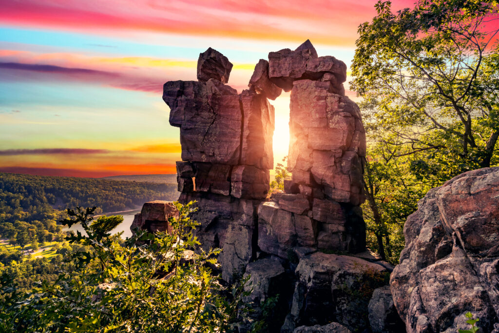Iconic Balanced Rock at Devil's Lake State Park at sunset. one of the best things to do in Baraboo WI