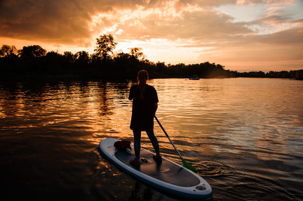 Paddleboarder at sunset on Lake Granbury.