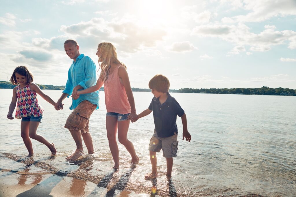 Family enjoying the beach, one of the best things to do in Orange County with Kids