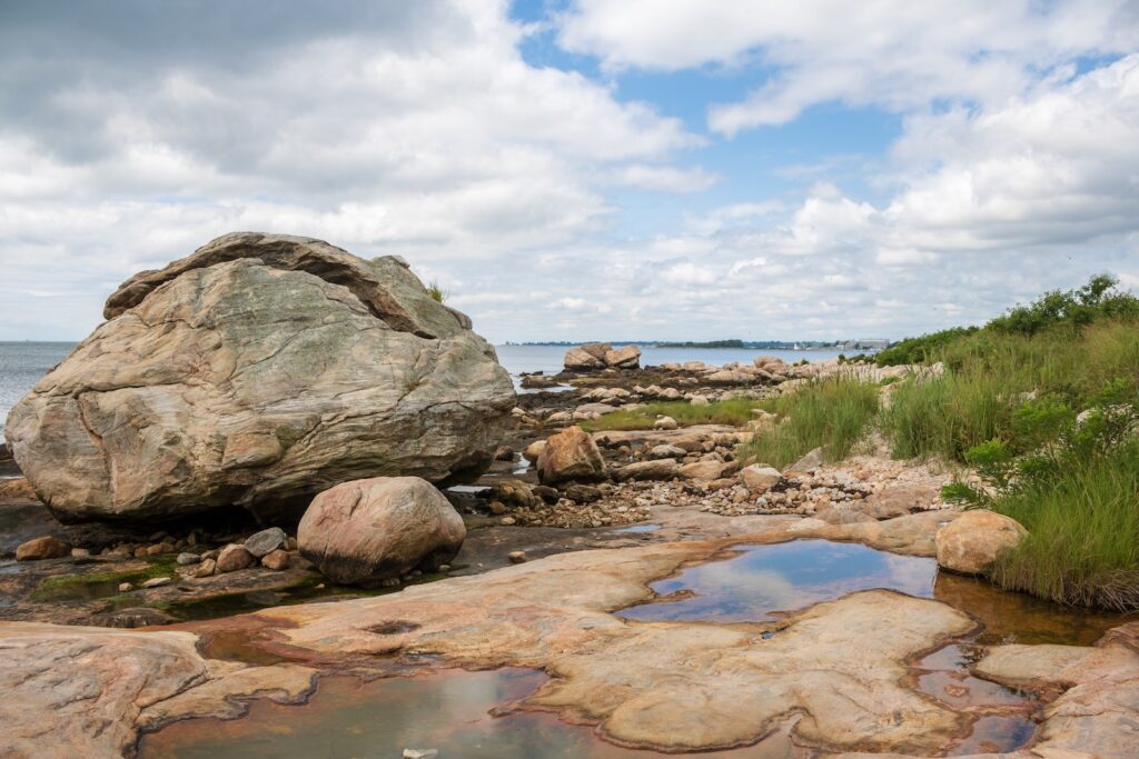 A large boulder on the Connecticut shoreline at Bluff Point State Park.