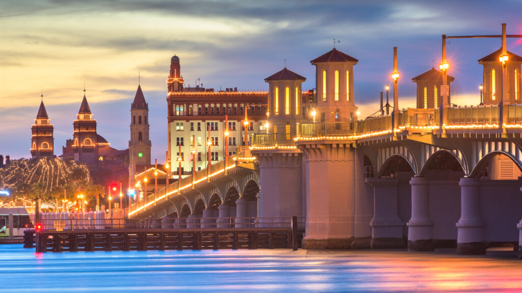 The Bridge of Lions lit up at dusk. St. Augustine is one of the best day trips from Flagler Beach Florida.