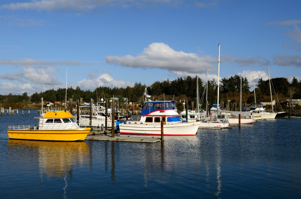 Small fishing boats in Coquille River Marina, take Bandon Boat Tours