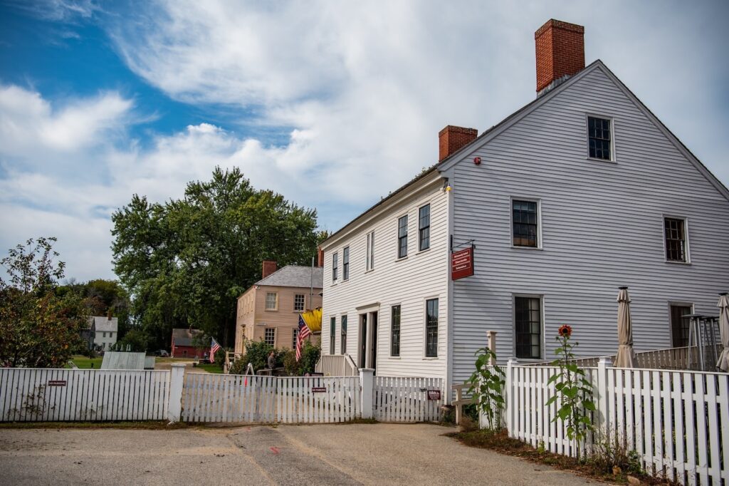 A white building and a picket fence, what you'll see during summer concerts at the Strawbery Banke Museum.