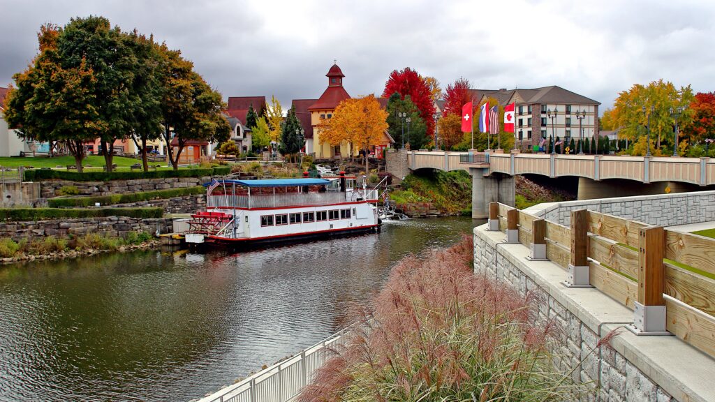 View of the Cass River, Riverplace Shops, and the Bavarian Belle, one of the best things to do in Frankenmuth.