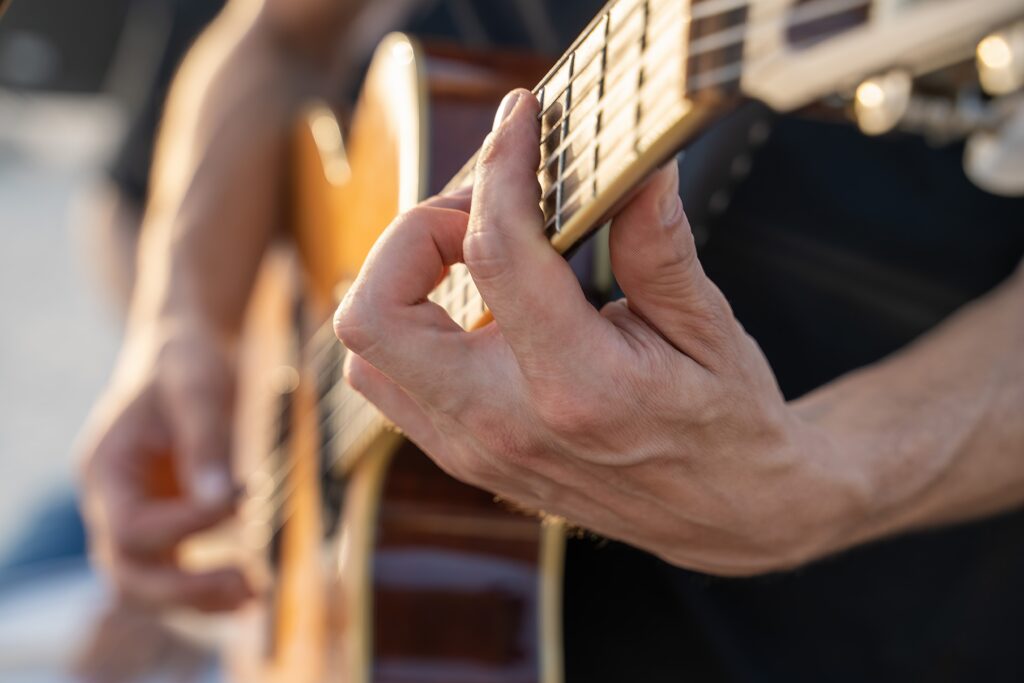 Close up of guitar player at Granbury Lakefest