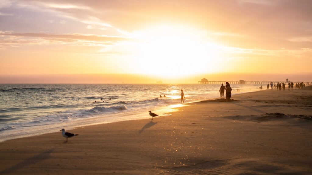 Explore Beaches for Kids in California with calm water, tide pools, and family friendly attractions across Orange County. Sunset over Huntington Beach, CA