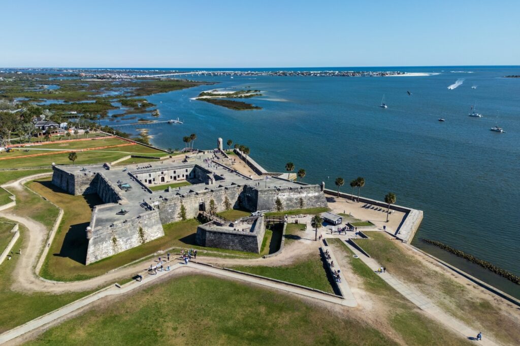 Aerial view of Castillo de San Marcos fort, one of the best museums in St. Augustine, with the St. Augustine inlet and Matanzas River in the background.