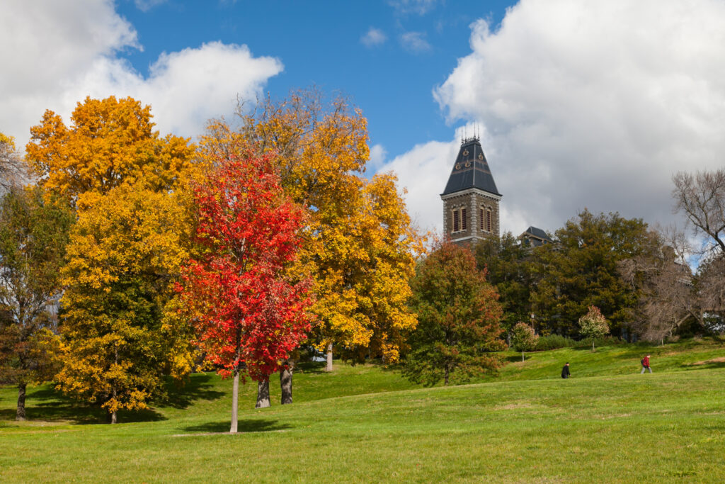 Fall Foliage and Cornell University building. Don't miss the best fall things to do in Ithaca NY