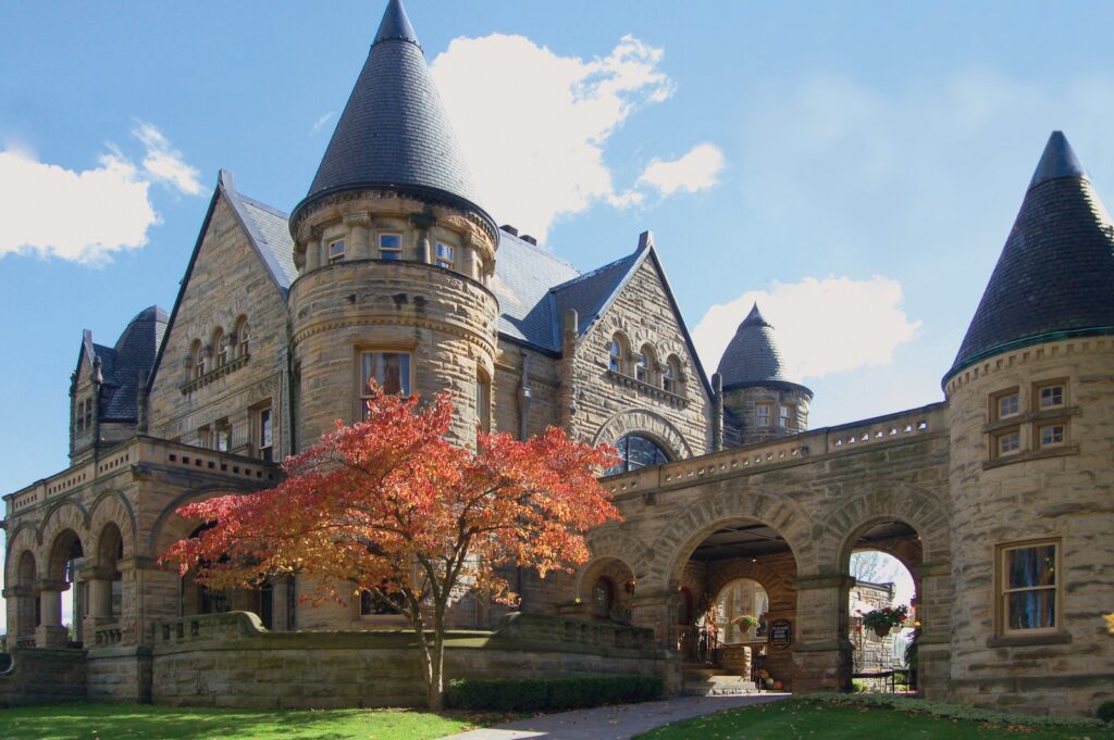 Looking for places to visit near Pittsburgh this fall? Explore state parks, Amish villages, and a historic castle hotel just north of the city, pictured here