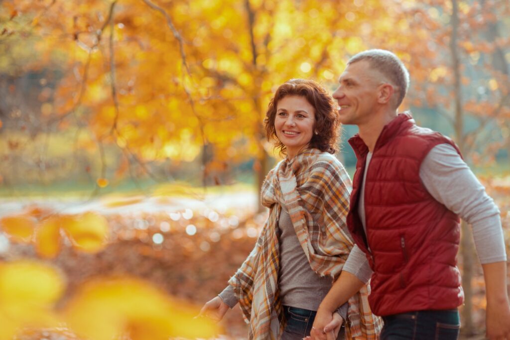 Happy couple enjoying the Fall Colors at the Lillian Anderson Arboretum