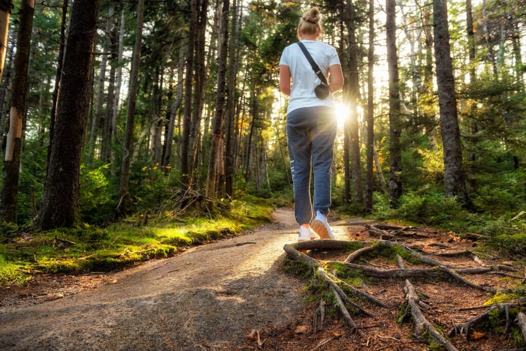 A woman enjoying a warm day hike in the Mad River Valley