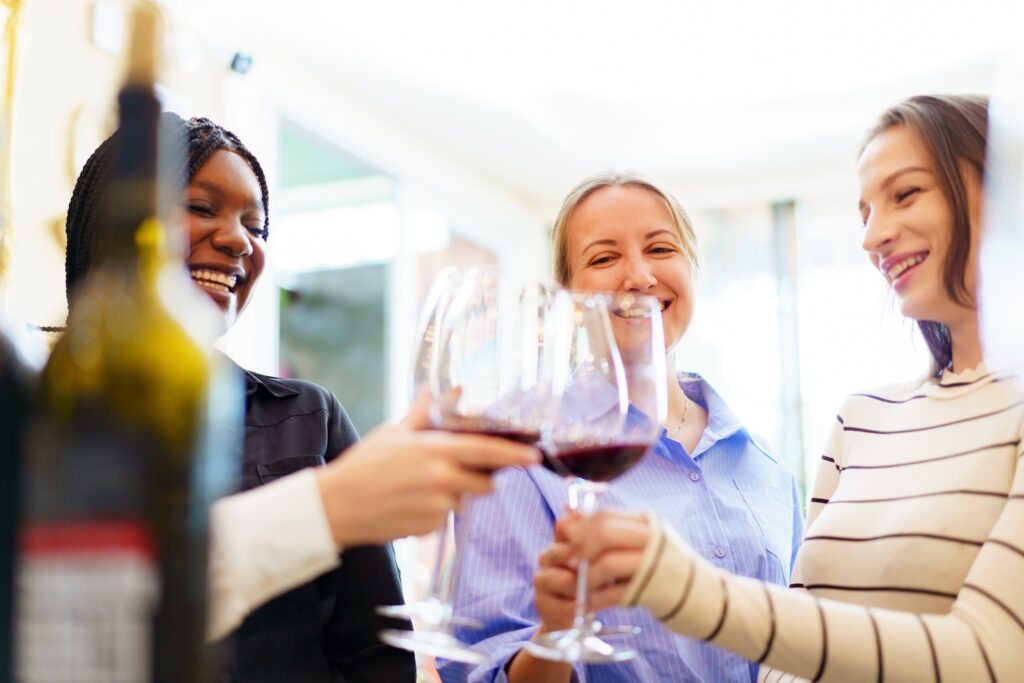 A group of women are talking and enjoying testing a wine together inside the restaurant on the Mercer County Wine and Brew Trail