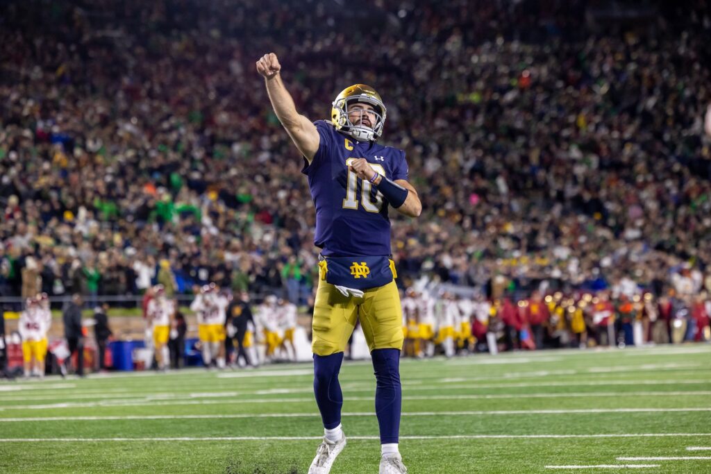 Notre Dame gameday quarterback celebrating in front of a packed crowd