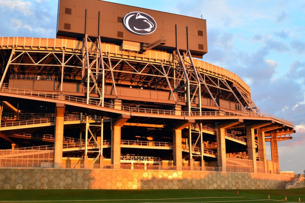 Penn State football tailgate destination Beaver Stadium glowing at sunset