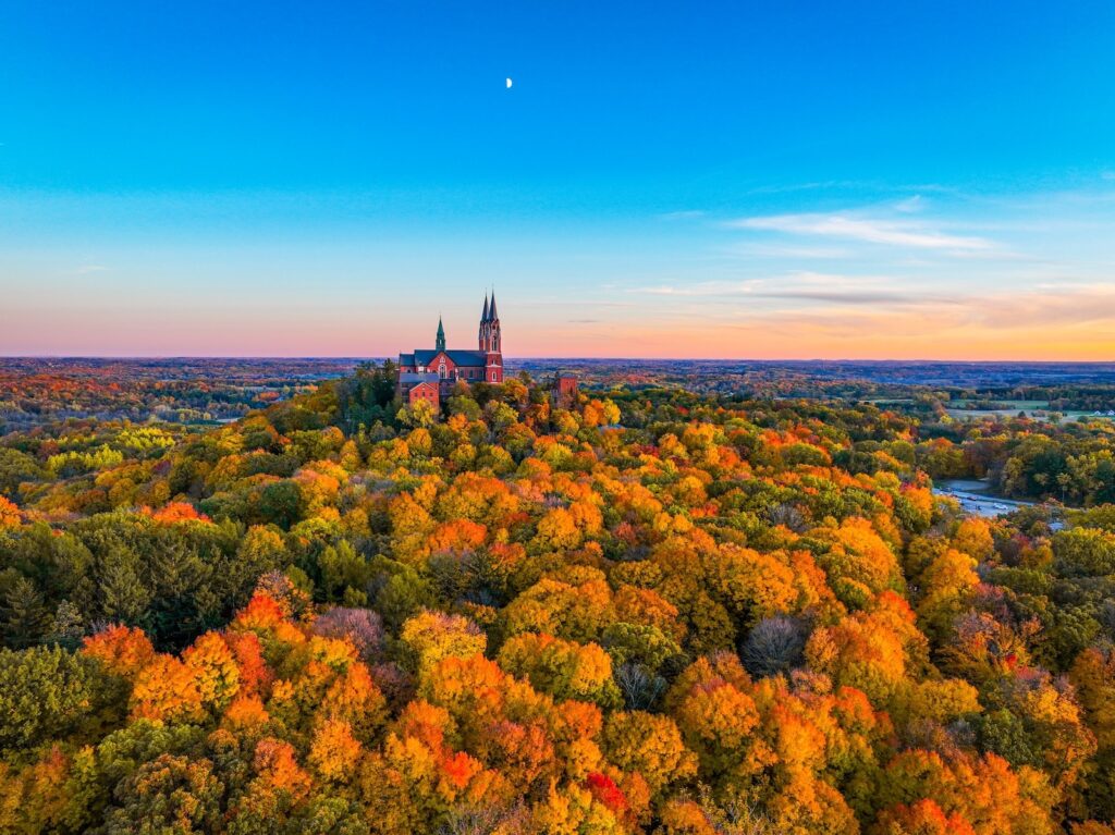 Wisconsin fall colors surrounding a basilica in West Bend, following the Wisconsin fall colors map.