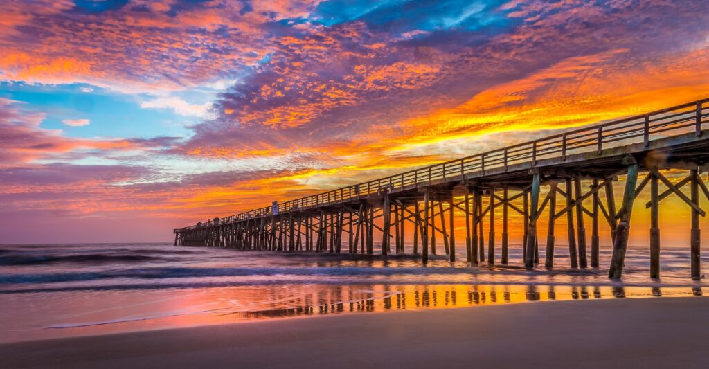 Beautiful view of the pier at Flagler Beach at sunrise. Florida in Fall